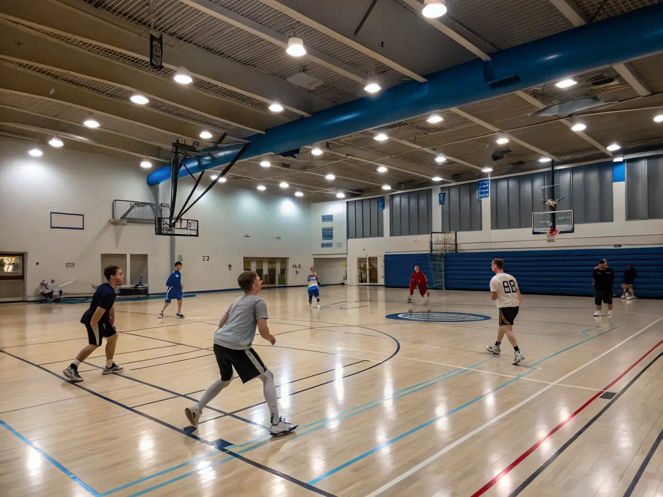 An image of adults participating in a basketball game at a community center, emphasizing fitness and camaraderie, with the UNION SPORTIVE PAYS DE FENELON banner displayed in the background.